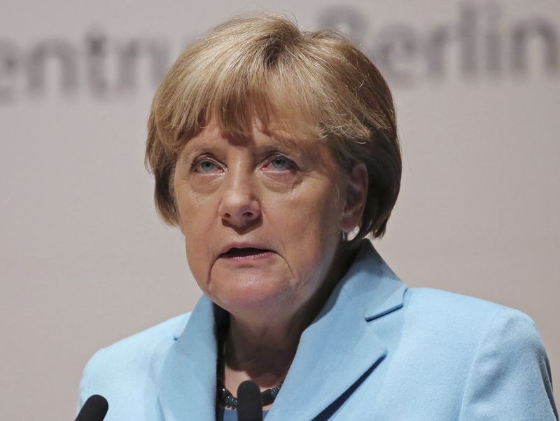 © Reuters. Germany's Chancellor Merkel speaks during the lecture meeting at Asahi Shimbun headquarters in Tokyo