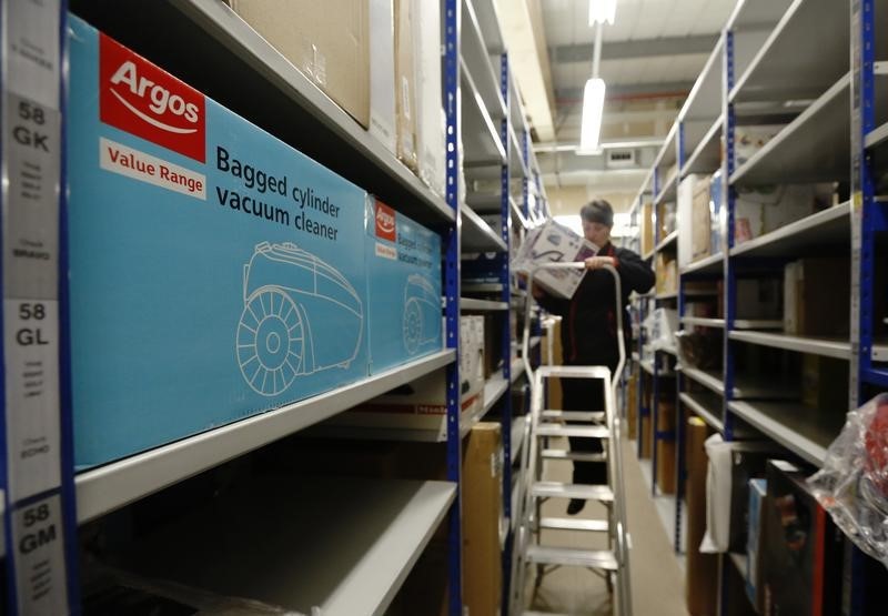 © Reuters. An employee poses in the storeroom of an Argos Extra store in Ashford south east England