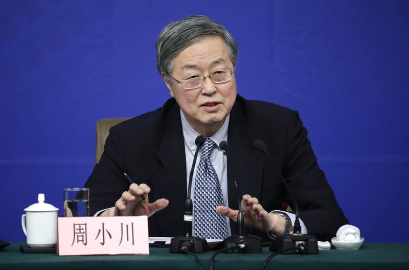 © Reuters. China's central bank governor Zhou Xiaochuan answers a question at a news conference in Beijing