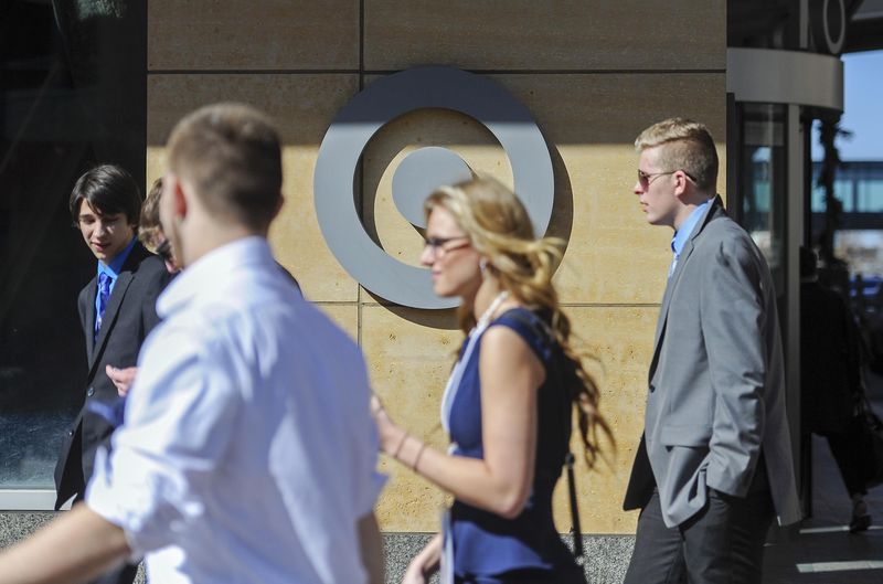 © Reuters. Pedestrians walk past Target headquarters after Target announced that 3,100 positions would be eliminated, in Minneapolis, Minnesota