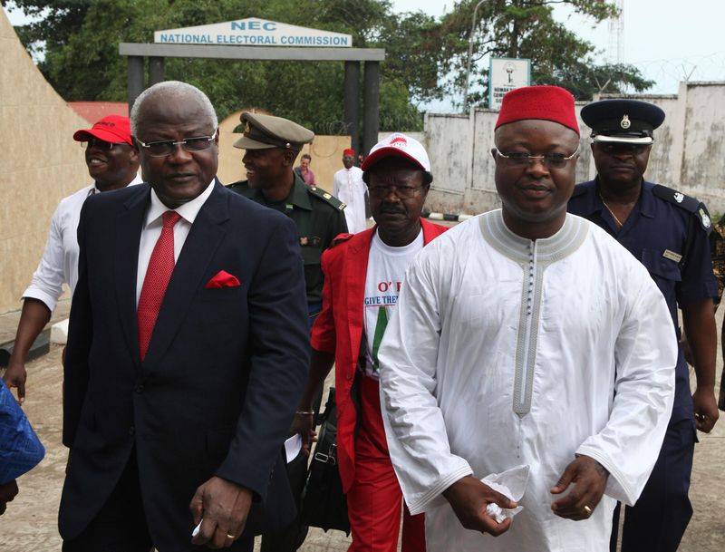 © Reuters. File photo of Sierra Leone's President Koroma and Vice President Sam-Sumana arriving at National Electoral Commission in Freetown