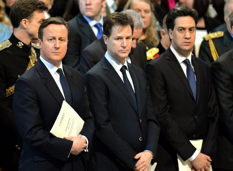 © Reuters. Britain's Prime Minister David Cameron stands alongside Deputy Prime Minister Nick Clegg, and Ed Miliband the leader of the opposition Labour Party as they attend the Commemoration Service for Afghanistan at St Paul's Cathedral in London