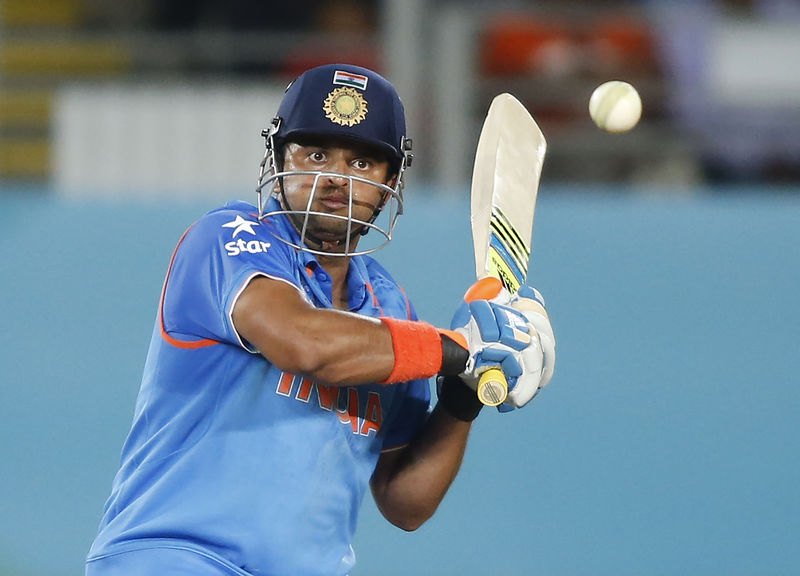 © Reuters. India's Raina line up a four during their Cricket World Cup match against Zimbabwe at Eden Park in Auckland