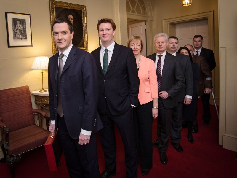 © Reuters. Britain's Chancellor of the Exchequer George Osborne leads his Treasury team as they prepare to leave number 11 Downing Street to pose for photographers before going to the House of Commons to present the Budget, in central London