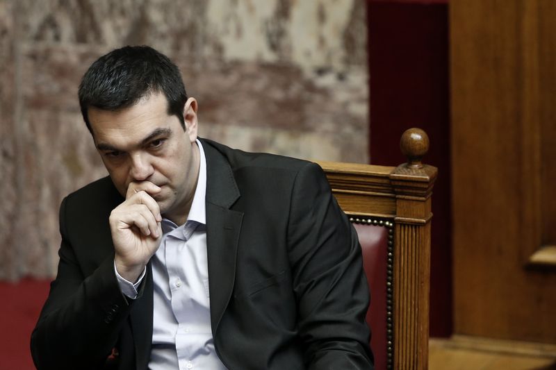 © Reuters. Greek PM Tsipras looks on before addressing lawmakers during a parliamentary session