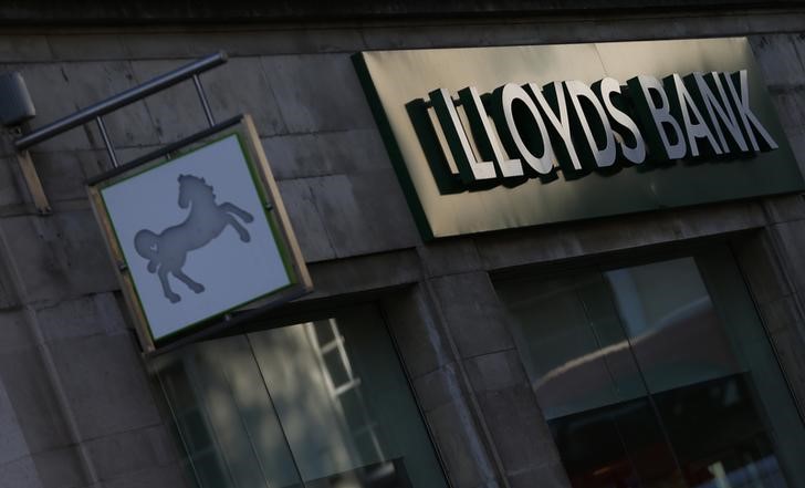 © Reuters. Signs are seen outside a branch of Lloyds Bank in central London