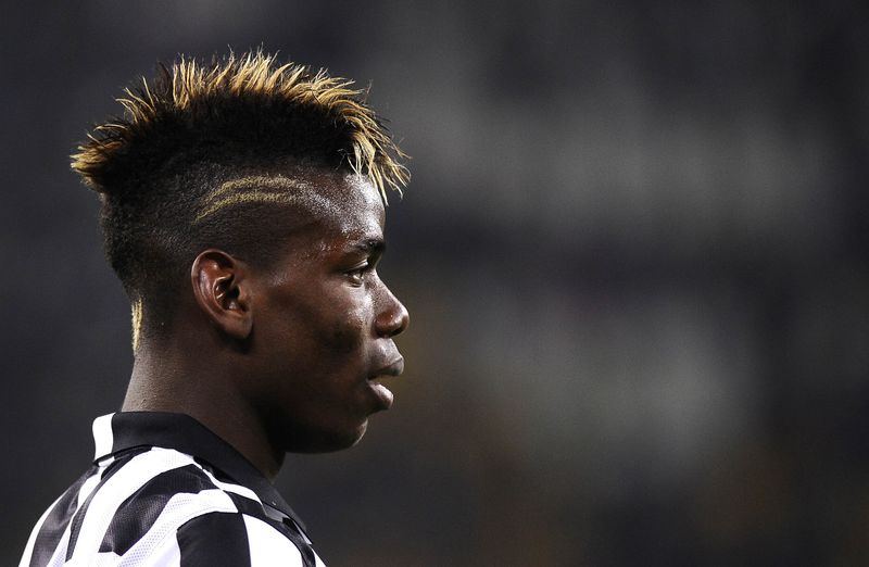 © Reuters. Juventus' Paul Lamine Pogba looks on during their Italian Serie A soccer match against Sassuolo in Turin