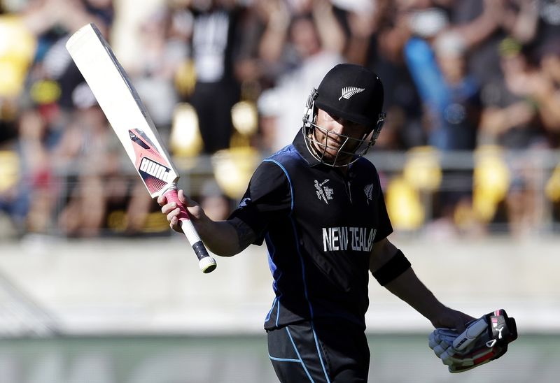 © Reuters. New Zealand's captain Brendon McCullum reacts as he walks off the field, after being dismissed for 77 runs from 25 deliveries, during the Cricket World Cup match against England at Wellington Stadium