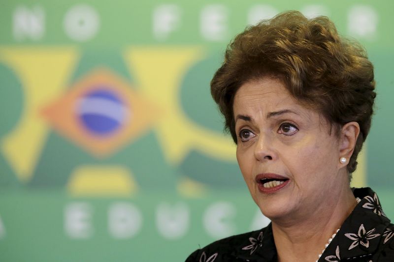 © Reuters. Brazil's President Dilma Rousseff reacts during a ceremony to announce measures to modernize Brazilian soccer at the Planalto Palace in Brasilia 