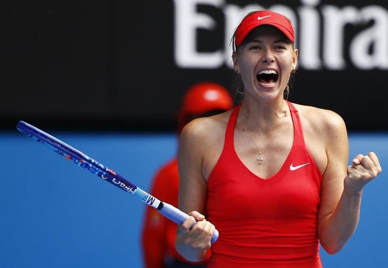 © Reuters. Sharapova of Russia celebrates after defeating compatriot Makarova in their women's singles semi-final match at the Australian Open 2015 tennis tournament in Melbourne