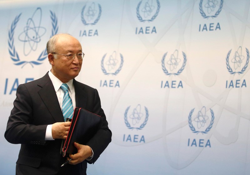 © Reuters. IAEA Director General Amano leaves a news conference after a board of governors meeting at the IAEA headquarters in Vienna