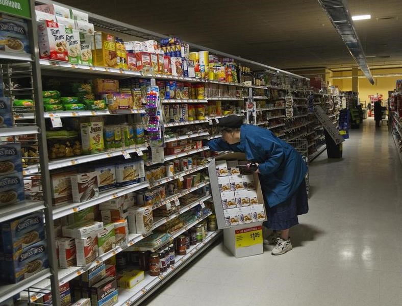 © Reuters. A woman looks for supplies at a Waldbaums grocery store in Long Beach, New York