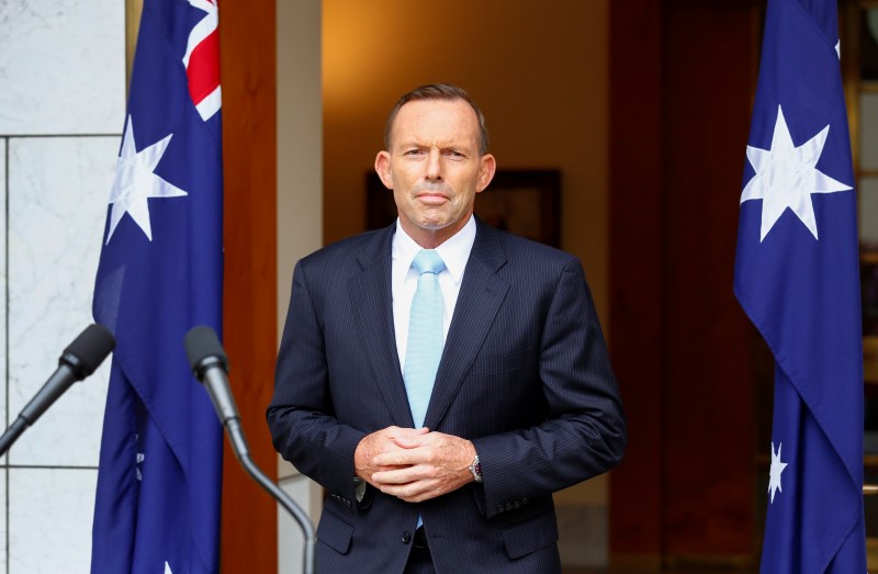 © Reuters. Australian PM Abbott addresses members of the media after a party room meeting at Parliament House in Canberra