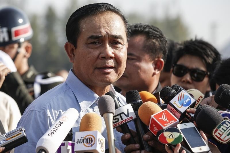 © Reuters. Chan-ocha answers questions from the media while attending national Children's Day at The Army base in central Bangkok