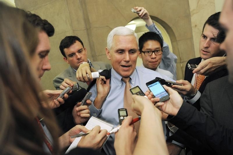 © Reuters. Pence talks with reporters as he departs a meeting about debt ceiling legislation with fellow Republicans at the U.S. Capitol in Washington