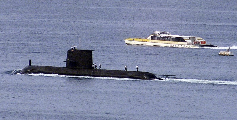 © Reuters. File photo of a Rivercat ferry passing by the Royal Australian Navy's newest Collins class submarine