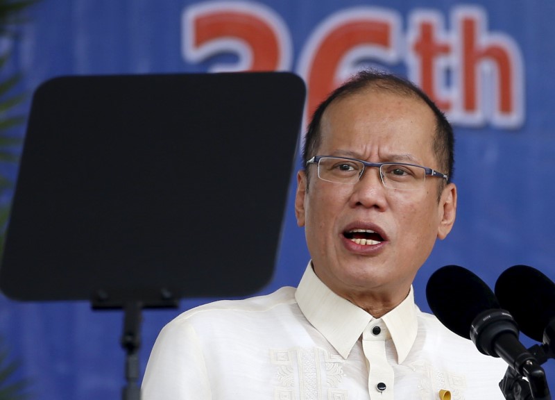 © Reuters. President Benigno Aquino reads his speech through a teleprompter during a graduation ceremony of police cadets at the Philippine National Police academy in Silang