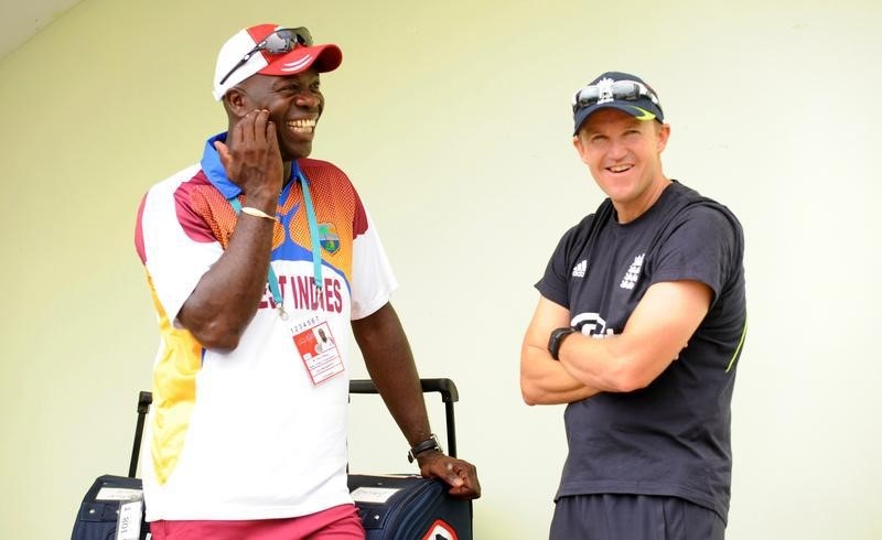 © Reuters. Gibson chats with Flower before their sides met in a group match at Providence stadium in Georgetown