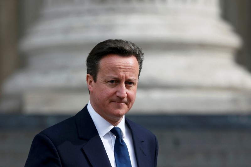 © Reuters. Britain's Prime Minister David Cameron leaves after a flypast of military aircraft  following the Afghanistan service of commemoration at St Paul's Cathedral in London