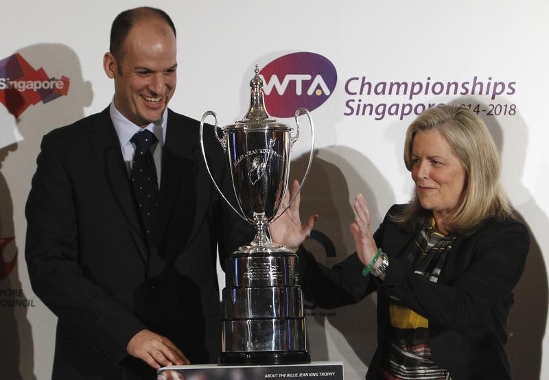 © Reuters. Allaster, Chairman and Chief Executive Officer of the Women's Tennis Association, gestures next to World Sports Group's Chief Operating Officer Georgiou  after a WTA announcement in Singapore