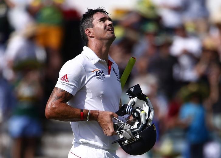 © Reuters. England's Pietersen reacts as he walks off the field after he caught out by Australia's Harris during the fourth day of the third Ashes test cricket match at the WACA ground in Perth