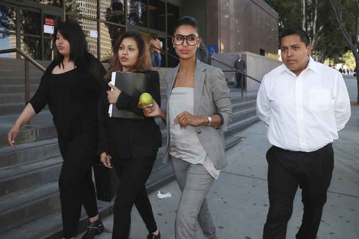 © Reuters. Companion of ex-NBA Clippers owner Donald Sterling, V. Stiviano, walks out of the courthouse in Los Angeles