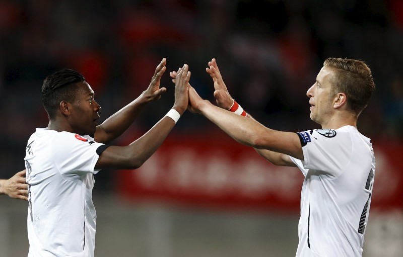 © Reuters. Austria's Alaba celebrates with teammate Janko after scoring the third goal against Liechtenstein during their Euro 2016 qualifying soccer match in Vaduz