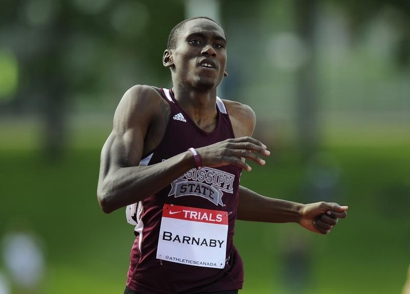 © Reuters. Barnaby reacts after winning the men's 400 meter finals at the Canadian Track and Field Olympic Trials in Calgary.