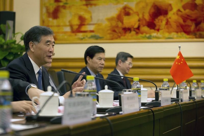 © Reuters. Wang attends a meeting in Beijing