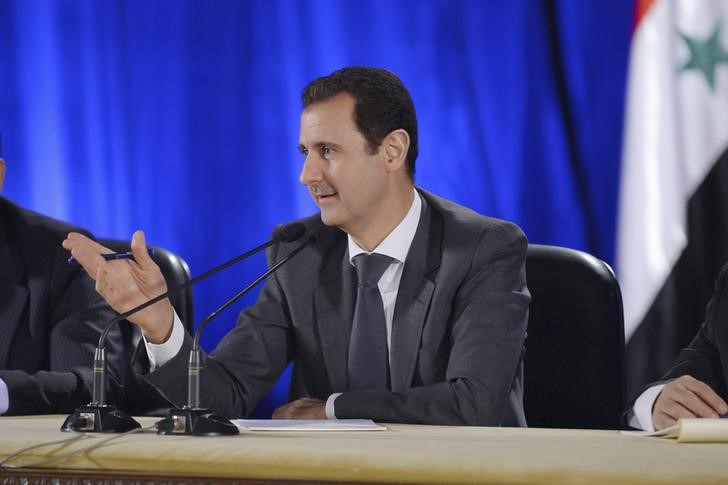 © Reuters. الأسد: روسيا تمد سوريا بالسلاح بموجب صفقات موقعة منذ بدء الصراع