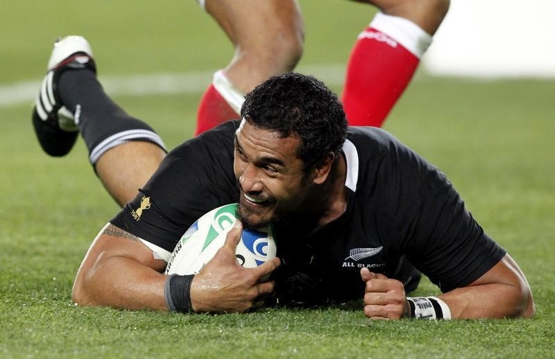 © Reuters. New Zealand All Blacks' Jerome Kaino smiles after scoring a try against Tonga during their Rugby World Cup Pool A match at Eden Park in Auckland