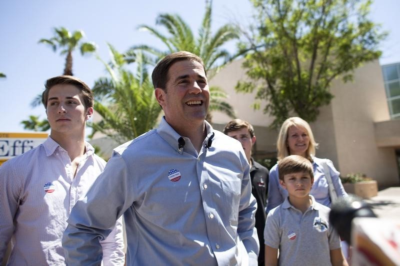 © Reuters. Ducey smiles after voting in Paradise Valley, Phoenix