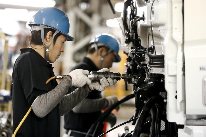 © Reuters. People work at the assembly line of the MFTBC factory in Kawazaki