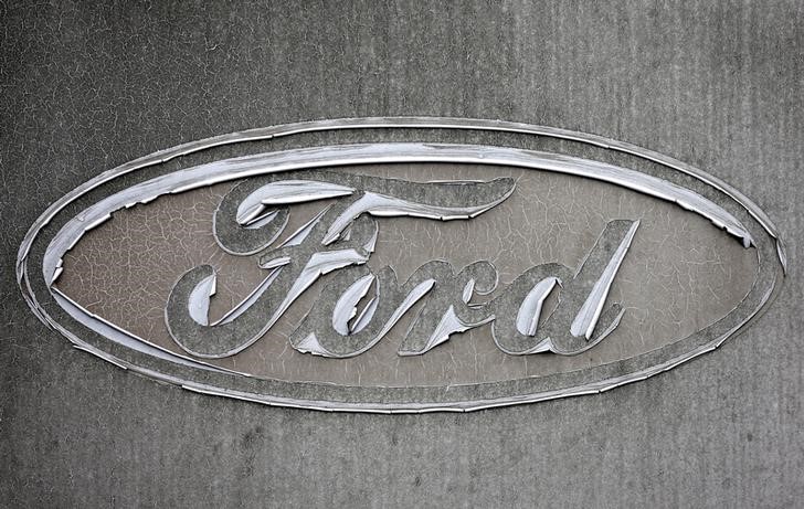 © Reuters. A faded Ford logo is pictured at the reception of the Ford assembly plant in Genk