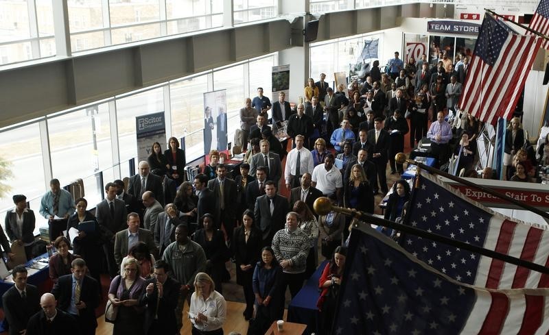 © Reuters. Job applicants listen to a presentation prior to the opening of a job fair held by the U.S. Chamber of Commerce and the Washington Nationals baseball club in Washington