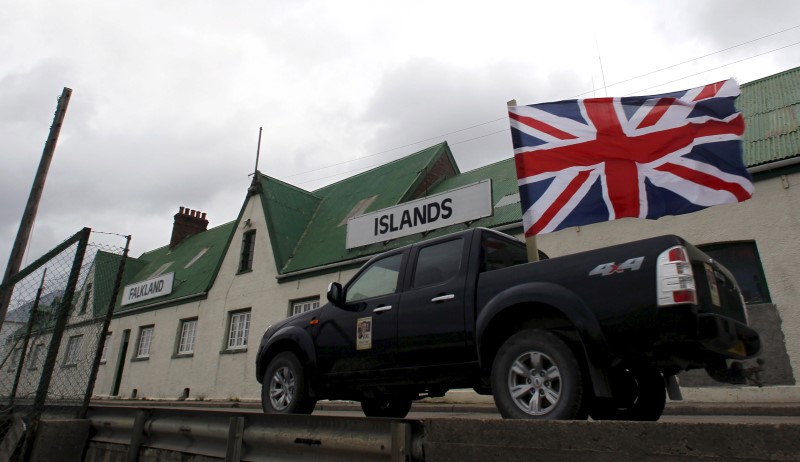 © Reuters. File photo of a vehicle decorated with Union Jack and Falkland Islands flags in what was called a "Victory" rally in Stanley