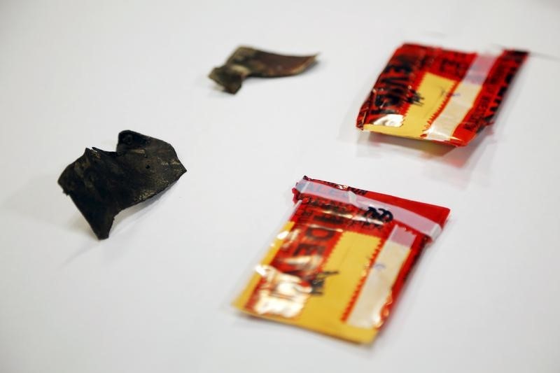 © Reuters. Pieces of shrapnel taken from the body of Boston Marathon bombing victim Krystle Campbell and presented as evidence in the trial of Dzhokhar Tsarnaev are displayed in Boston