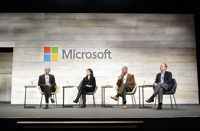 © Reuters. Microsoft Corp Chief Executive Satya Nadella,, Executive Vice President and Chief Financial Officer Amy Hood, Chairman John Thompson, and Executive Vice President and General Counsel Brad Smith take questions at the annual shareholders' meeting in Be