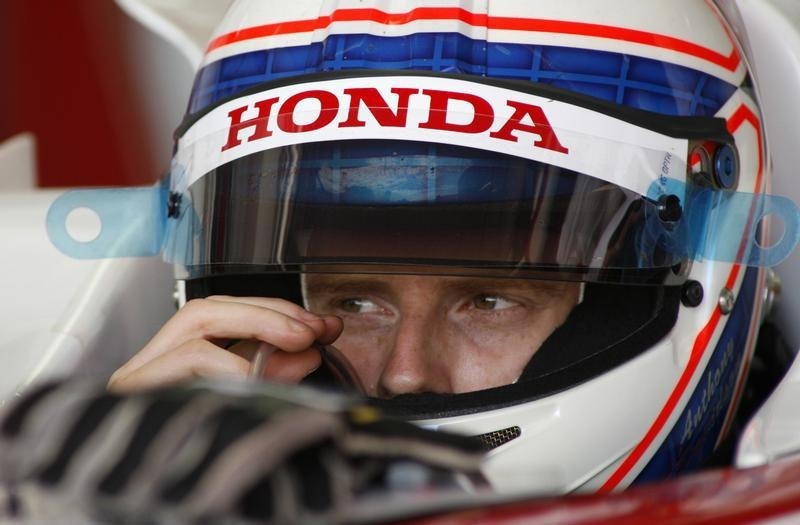 © Reuters. Formula One driver Anthony Davidson of Britain gestures inside his Super Aguri racing car during a training session at Catalunya's racetrack in Montmelo