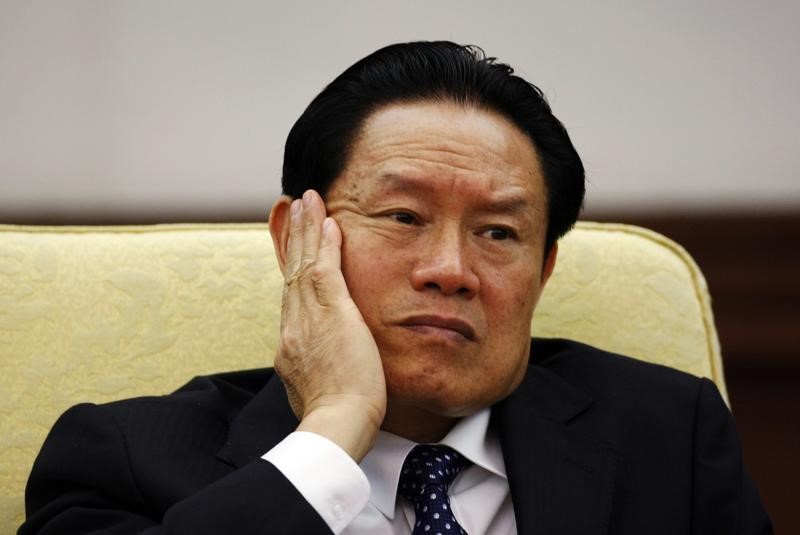 © Reuters. China's former Public Security Minister Zhou reacts as he attends the Hebei delegation discussion sessions at the 17th National Congress of the CPC in Beijing