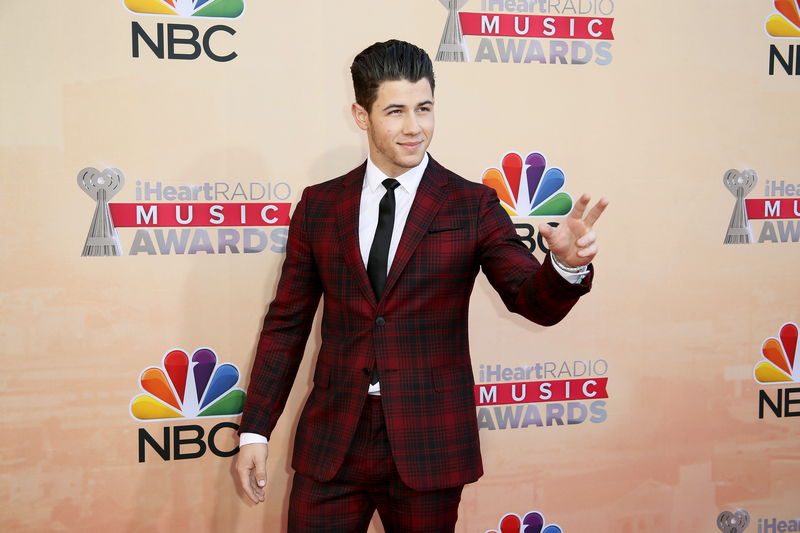 © Reuters. Singer Nick Jonas poses at the 2015 iHeartRadio Music Awards in Los Angeles