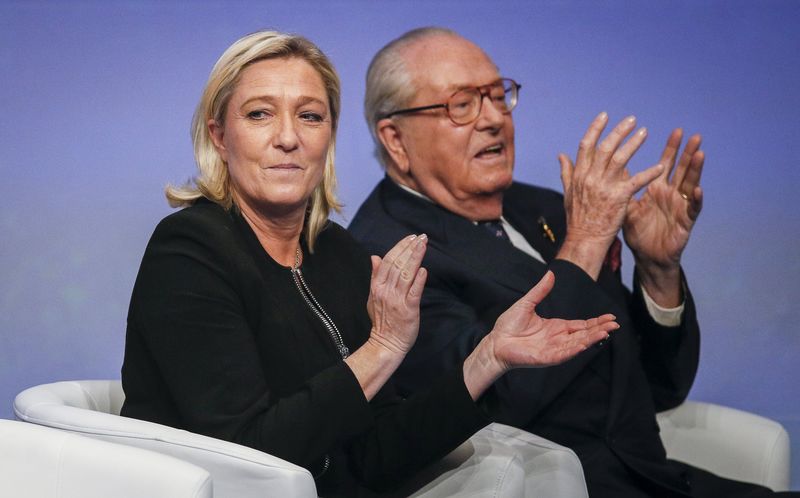 © Reuters. File photo of Marine Le Pen, France's National Front political party leader, and her father Jean-Marie Le Pen during their party congress in Lyon