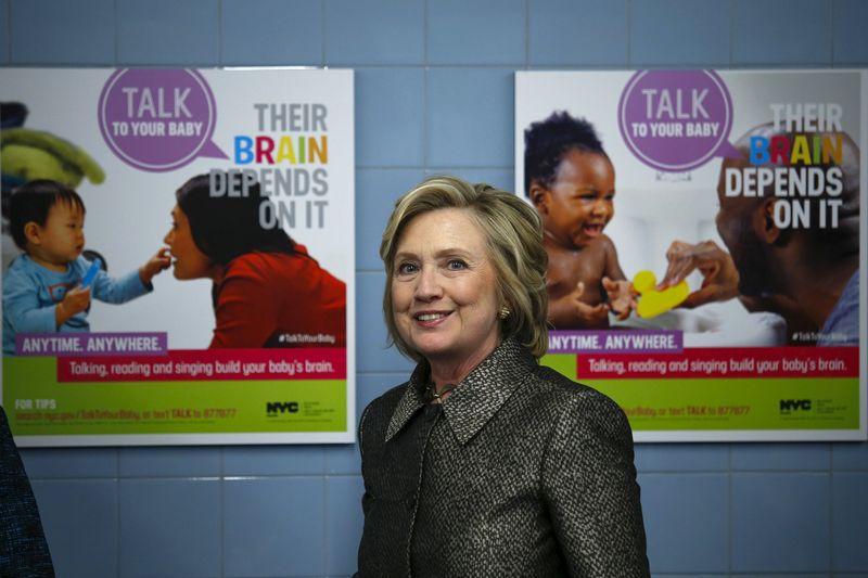 © Reuters. Former U.S. Secretary of State Clinton leaves the room after attending the early childhood development initiative "talk to you baby" in Brooklyn, New York