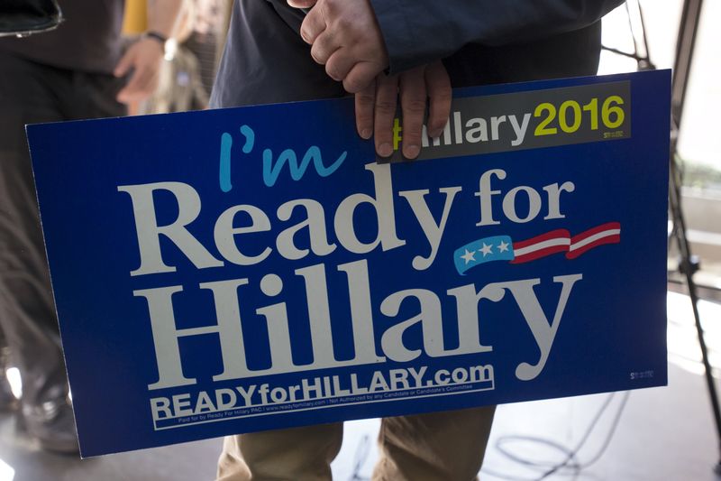 © Reuters. A supporter holds an "I'm Ready for Hillary" sign during the "Ready for Hillary" rally in Manhattan, New York