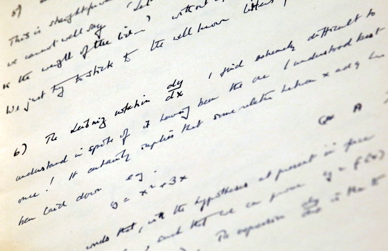 © Reuters. Page from a notebook of British mathematician and pioneer in computer science Turing is seen during an auction preview in Hong Kong