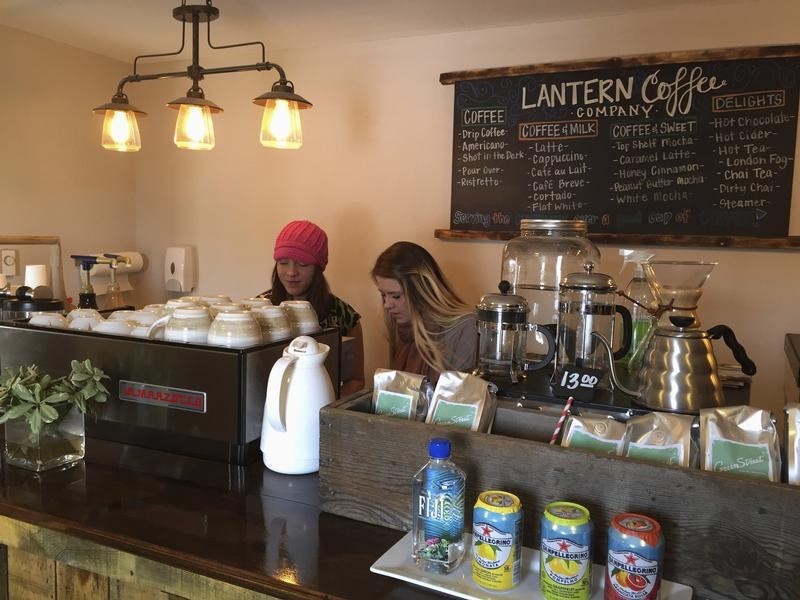 © Reuters. Baristas prepare for Friday's grand opening at the Lantern Coffee Company in Williston, North Dakota