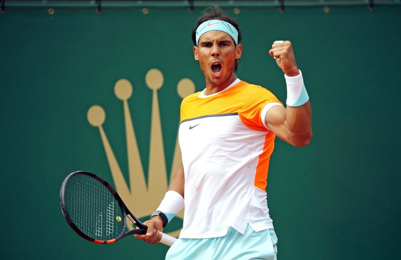 © Reuters. Rafael Nadal of Spain reacts during his match against John Isner of the US at the Monte Carlo Masters in Monaco