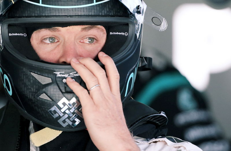 © Reuters. Mercedes Formula One driver Rosberg of Germany sits on his car during the third practice session ahead of the Chinese F1 Grand Prix at the Shanghai International Circuit