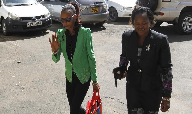 © Reuters. Jeptoo is escorted as she arrives at the Athletics Kenya headquarters after failing a doping test in Nairobi