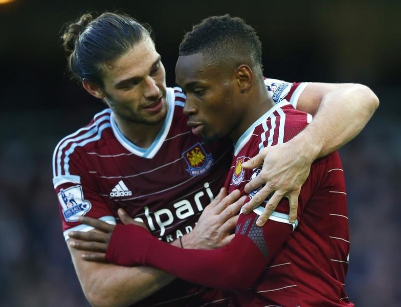 © Reuters. Diafra Sakho of West Ham United celebrates scoring his team's third goal against Swansea City with Andy Carroll during their English Premier League soccer match at Upton Park in London